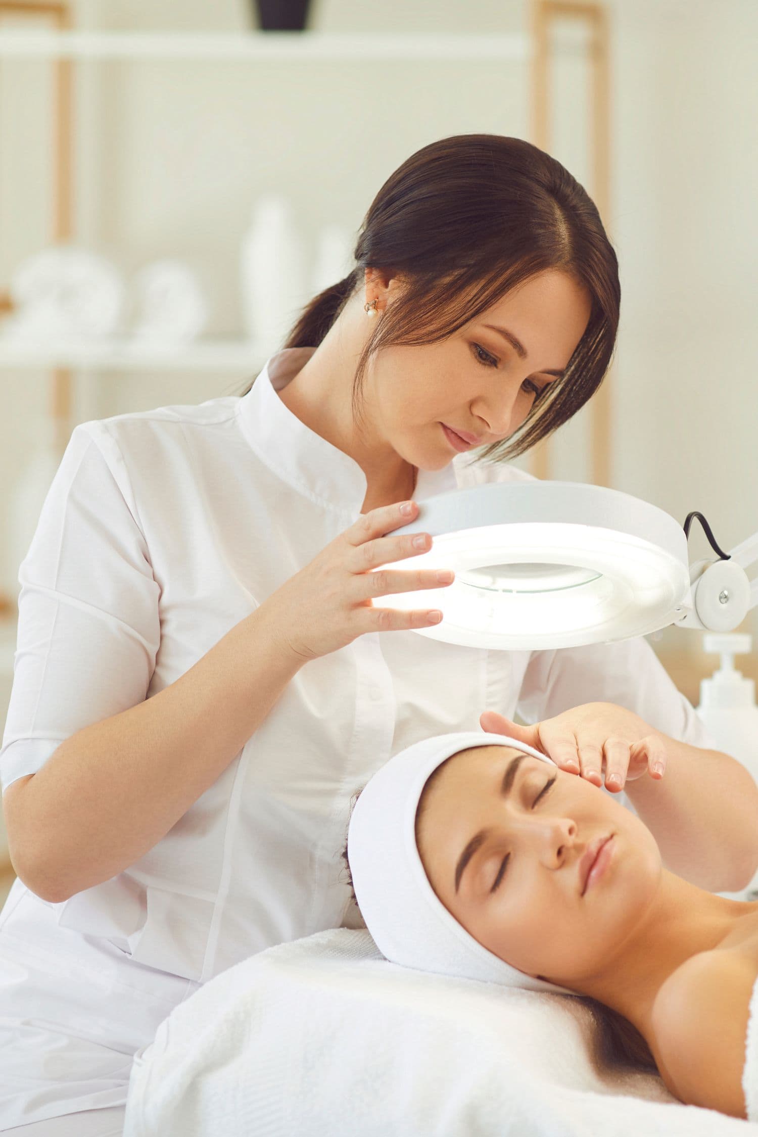 Dermatology specialist examining a patient's skin