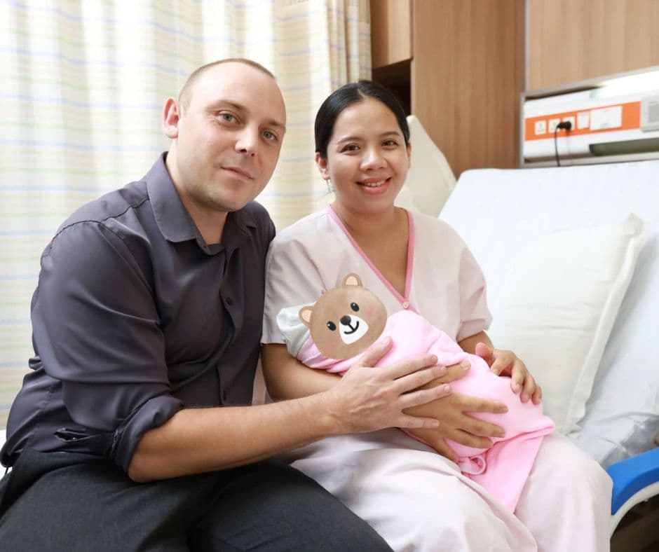 Mother with her newborn babies after fertility treatment
